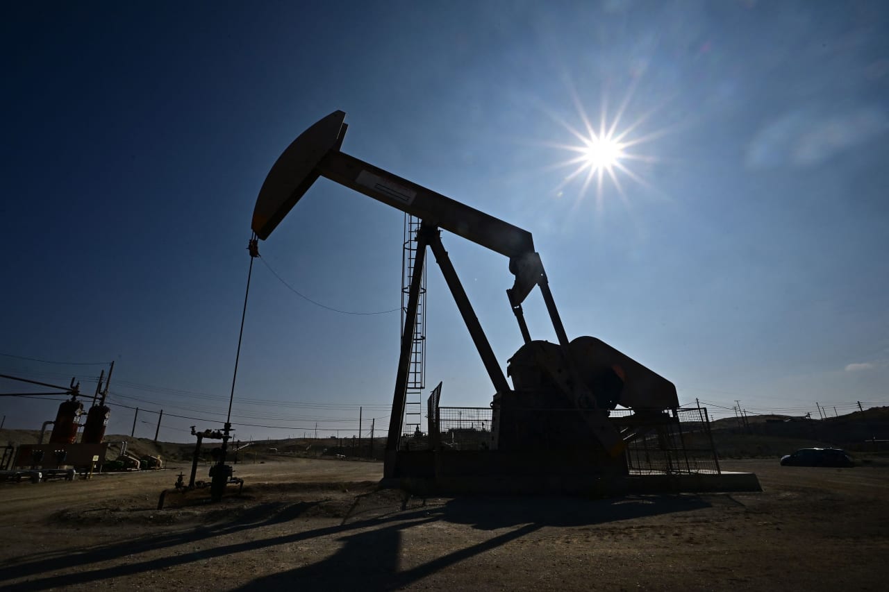 Oil prices tick higher after sinking on higher product inventories