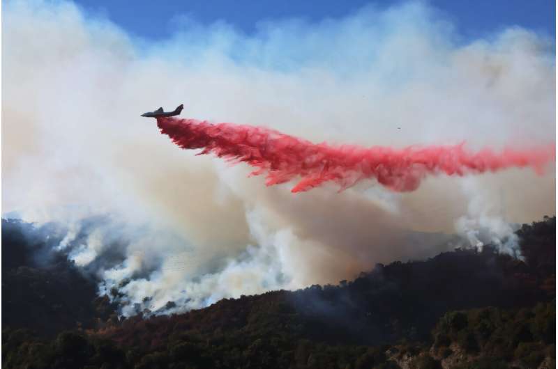 Firefighters race to beat LA blazes as winds grow and death toll hits 16