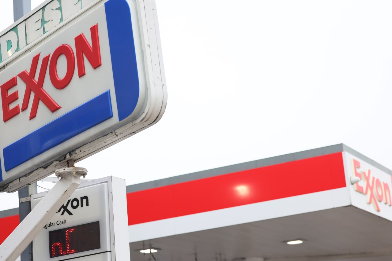 Exxon Mobil warns that lower oil prices and tighter refining margins will weigh on earnings